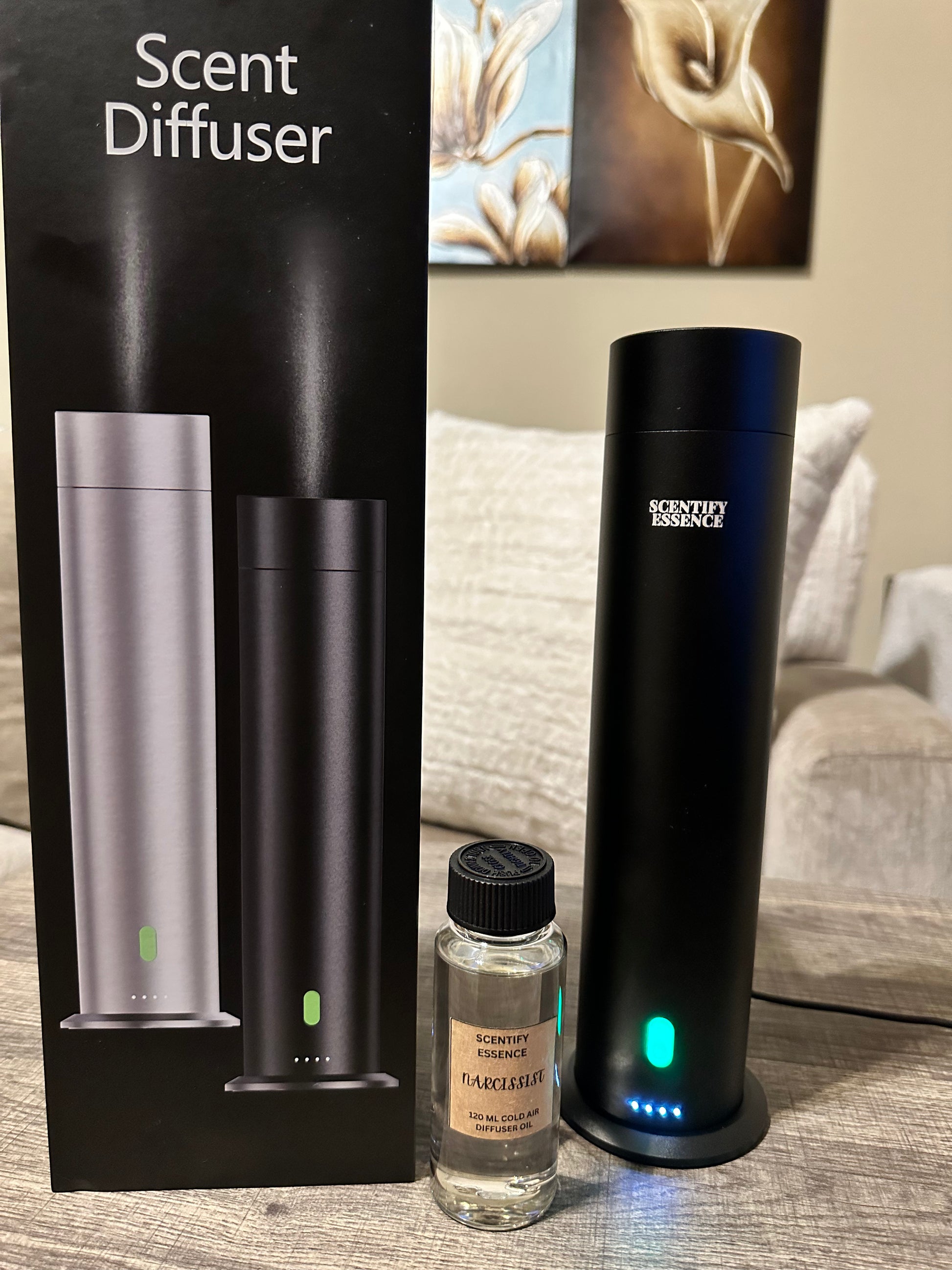 Scent diffuser with packaging and a 120 ml bottle of cold air oil. 